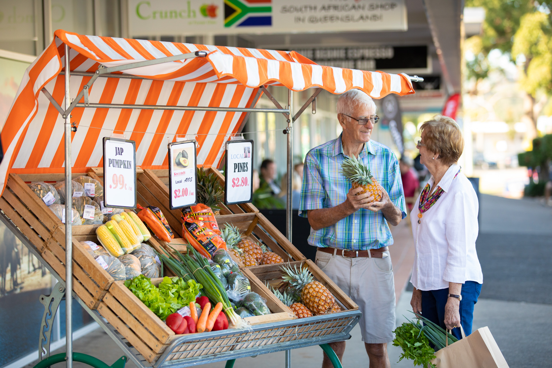 Older man and woman shopping for fruit and vegetables